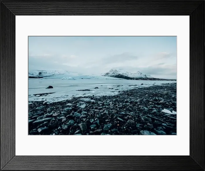 Framed Print : Breathtaking glacier in Iceland with black rock and large ice sheets, melting ice due to climate change Framed Print : Breathtaking glacier in Iceland with black rock and large ice sheets, melting ice due to climate change
