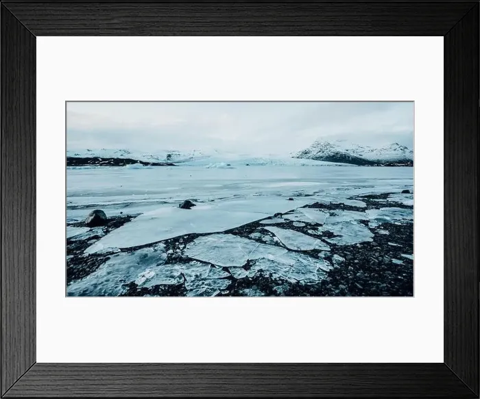 Framed Print : Breathtaking glacier in Iceland with black rock and large ice sheets, melting ice due to climate change Framed Print : Breathtaking glacier in Iceland with black rock and large ice sheets, melting ice due to climate change