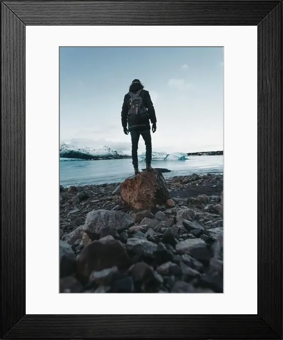 Framed Print : Hiking on a glacier in Iceland, breathtaking views, traveler stands on stone Framed Print : Hiking on a glacier in Iceland, breathtaking views, traveler stands on stone