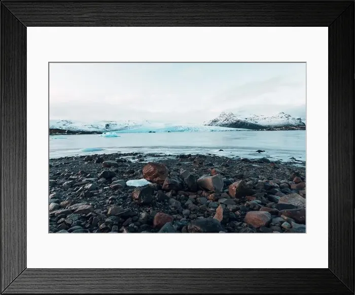 Framed Print : Breathtaking glacier in Iceland with black rock and large ice sheets, melting ice due to climate change Framed Print : Breathtaking glacier in Iceland with black rock and large ice sheets, melting ice due to climate change