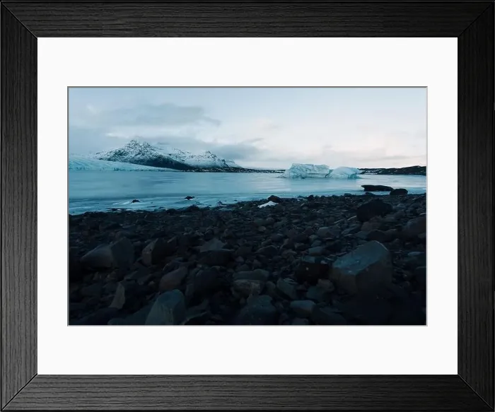 Framed Print : Breathtaking glacier in Iceland with black rock and large ice sheets, melting ice due to climate change Framed Print : Breathtaking glacier in Iceland with black rock and large ice sheets, melting ice due to climate change