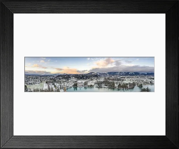 Framed Print : Panoramic aerial drone shot view of Leopoldskroner lake southwest of outskirts of Salzburg during winter
