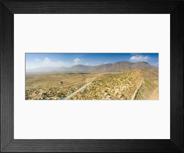 Framed Print : Panoramic view by drone of road crossing Berhale village, Danakil desert, Afar Region, Ethiopia, Africa Framed Print : Panoramic view by drone of road crossing Berhale village, Danakil desert, Afar Region, Ethiopia, Africa
