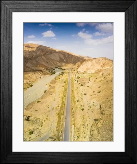 Framed Print : Panoramic view by drone of straight empty road through Danakil desert, Afar Region, Ethiopia, Africa Framed Print : Panoramic view by drone of straight empty road through Danakil desert, Afar Region, Ethiopia, Africa