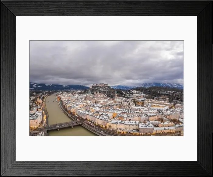 Framed Print : Aerial drone overview of Salzburg old town skyline covered with snow and view of Hohensalzburg in Austria winter Framed Print : Aerial drone overview of Salzburg old town skyline covered with snow and view of Hohensalzburg in Austria winter