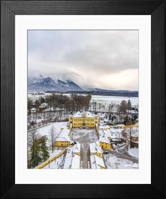 Framed Print : aerial view of Schloss Hellbrunn covered in snow with view of Untersberg near Salzburg Outskirts in winter time Framed Print : aerial view of Schloss Hellbrunn covered in snow with view of Untersberg near Salzburg Outskirts in winter time