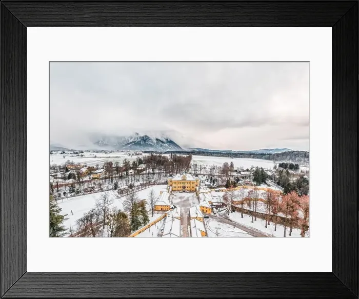 Framed Print : Aerial view of Schloss Hellbrunn covered in snow with view of Untersberg near Salzburg Outskirts in winter time Framed Print : Aerial view of Schloss Hellbrunn covered in snow with view of Untersberg near Salzburg Outskirts in winter time