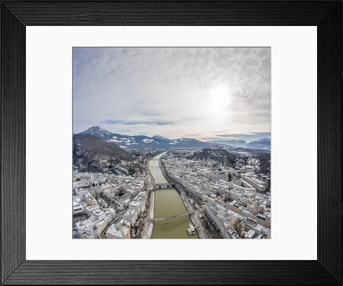 Framed Print : Aerial drone shot view of Salzach river across snowy Salzburg city covered with snow in winter morning Framed Print : Aerial drone shot view of Salzach river across snowy Salzburg city covered with snow in winter morning