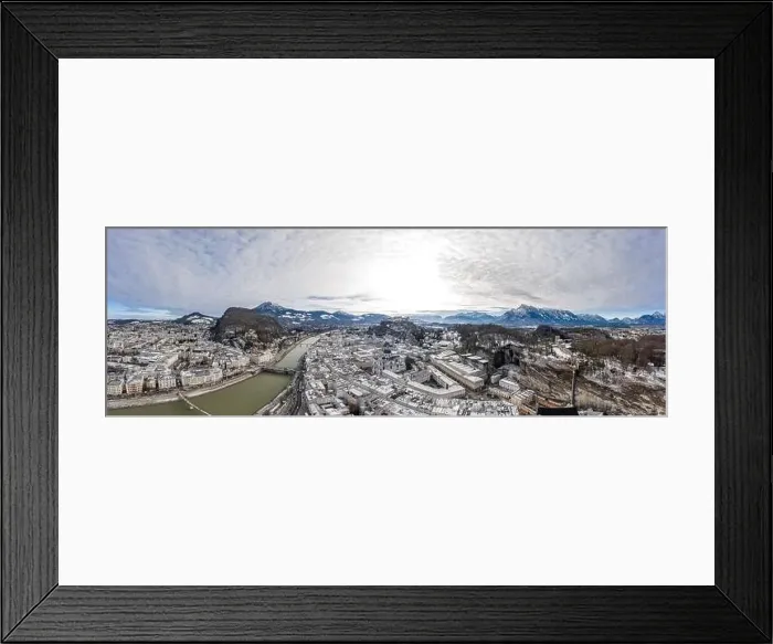 Framed Print : Aerial drone shot view of snowy salzburg city along river and mountain ridges in winter Framed Print : Aerial drone shot view of snowy salzburg city along river and mountain ridges in winter