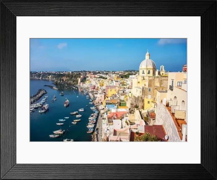 Framed Print : Aerial drone view of vibrantly colorful houses of Marina Corricella in sunny summer weather at Procida island, Italy