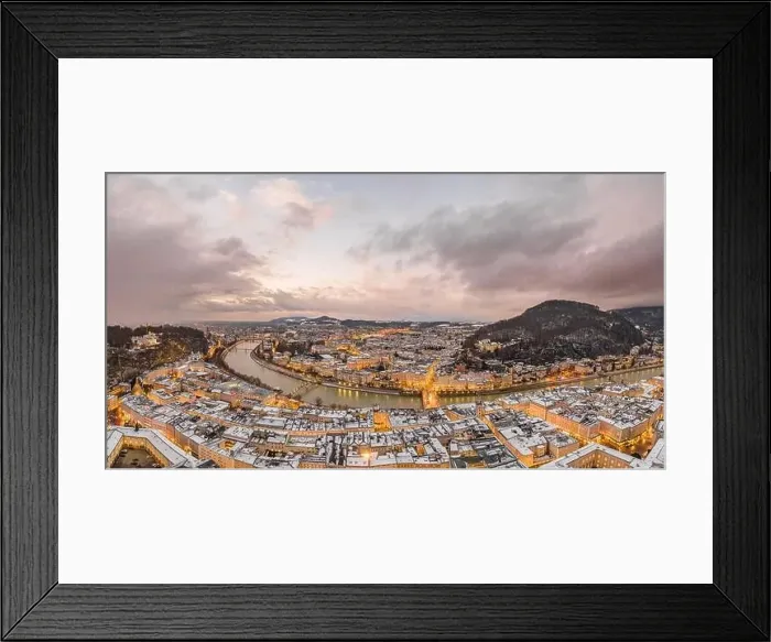 Framed Print : Aerial view of northern Salzburg city along river during sunset hour in snowy winter Framed Print : Aerial view of northern Salzburg city along river during sunset hour in snowy winter