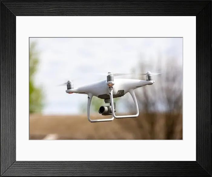 Framed Print : Drone quadrocopter with high resolution digital camera on the sky background Framed Print : Drone quadrocopter with high resolution digital camera on the sky background