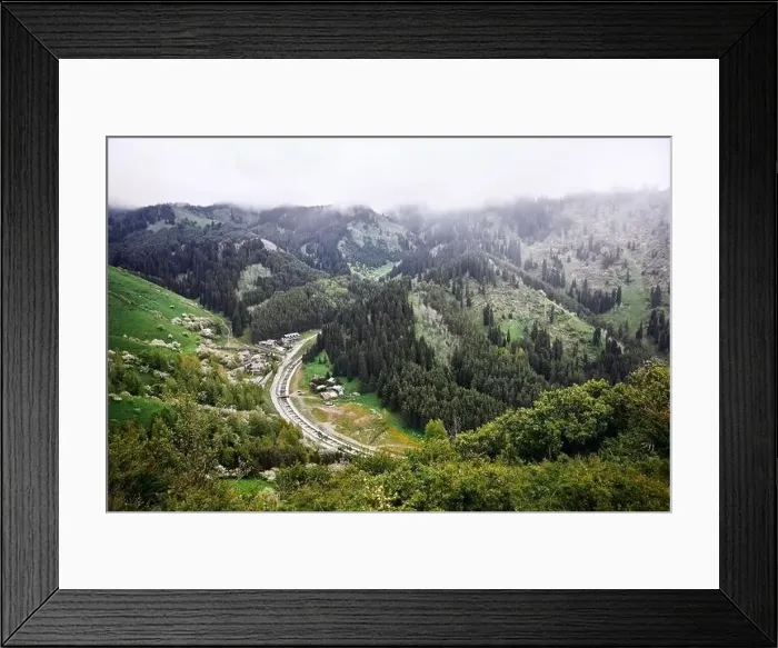 Framed Print : Aerial view of the alpine village and river in the mountains at foggy clouds. Photo taken with Drone Framed Print : Aerial view of the alpine village and river in the mountains at foggy clouds. Photo taken with Drone