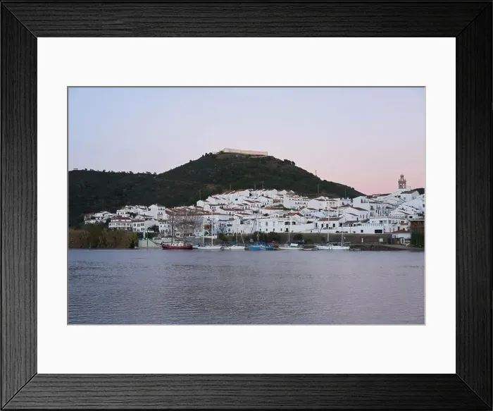 Framed Print : Sanlucar de Guadiana in Spain and Alcoutim in Portugal with sail boats on Guadiana river