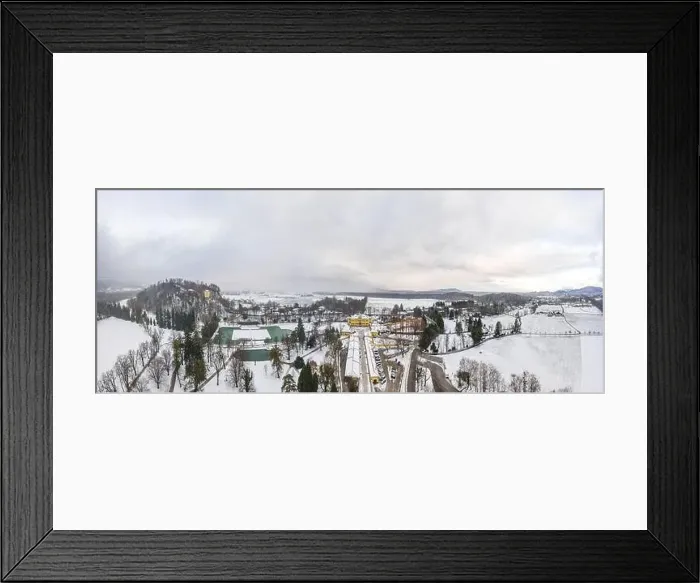 Framed Print : Aerial view of Schloss Hellbrunn covered in snow near Salzburg outskirts in winter time