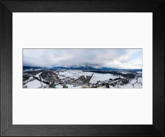 Framed Print : Panoramic aerial view of Salzburg outskirts snowy villages during sunset hour with clouds after snow storm in winter Framed Print : Panoramic aerial view of Salzburg outskirts snowy villages during sunset hour with clouds after snow storm in winter