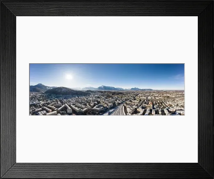Framed Print : Panoramic aerial drone view of Salzburg snowy old town with view of Unesberg Kapuzinerberg mountain and train station Framed Print : Panoramic aerial drone view of Salzburg snowy old town with view of Unesberg Kapuzinerberg mountain and train station