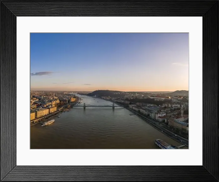 Framed Print : Aerial drone shot of Danube river with chain bridge and Buda Castle in Budapest in Sunset hour Framed Print : Aerial drone shot of Danube river with chain bridge and Buda Castle in Budapest in Sunset hour