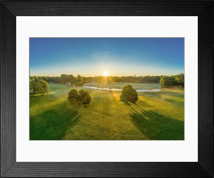 Framed Print : Wonderful sunrise over the English Garden in Munich. Sunbeams are shining through the trees Framed Print : Wonderful sunrise over the English Garden in Munich. Sunbeams are shining through the trees