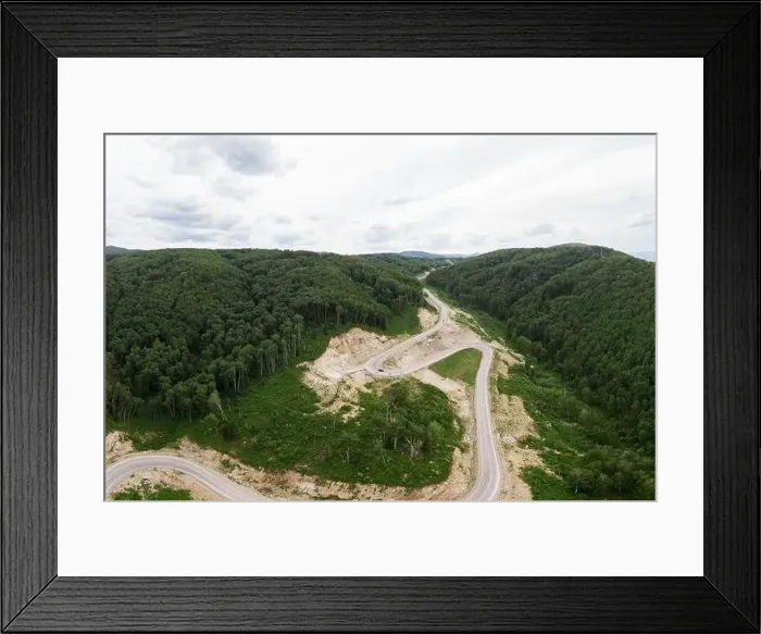 Framed Print : Aerial top vew of winding road in the mountains Framed Print : Aerial top vew of winding road in the mountains