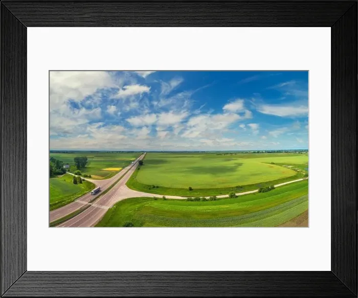 Framed Print : Summer rural landscape, aerial view. View of green fields, forest, village and highway Framed Print : Summer rural landscape, aerial view. View of green fields, forest, village and highway