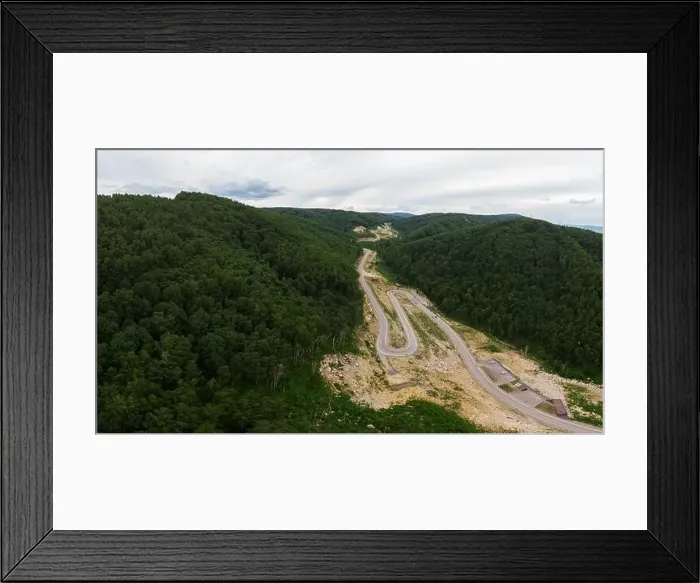 Framed Print : Aerial top vew of winding road in the mountains Framed Print : Aerial top vew of winding road in the mountains