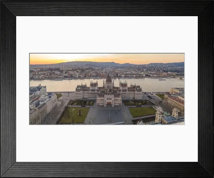 Framed Print : Panoramic aerial drone shot of Hungarian Parliament by Danube river in Kossuth Square in Budapest sunset Framed Print : Panoramic aerial drone shot of Hungarian Parliament by Danube river in Kossuth Square in Budapest sunset