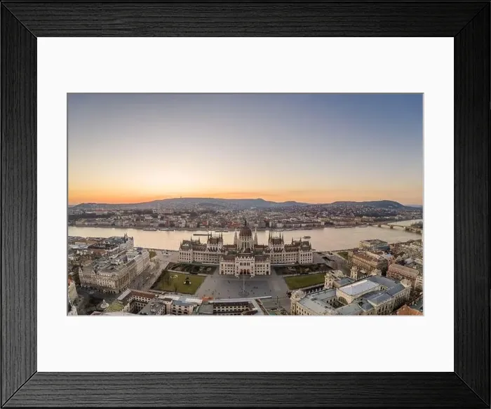 Framed Print : Aerial drone shot of Hungarian Parliament by Danube river in Kossuth Square in Budapest sunset Framed Print : Aerial drone shot of Hungarian Parliament by Danube river in Kossuth Square in Budapest sunset