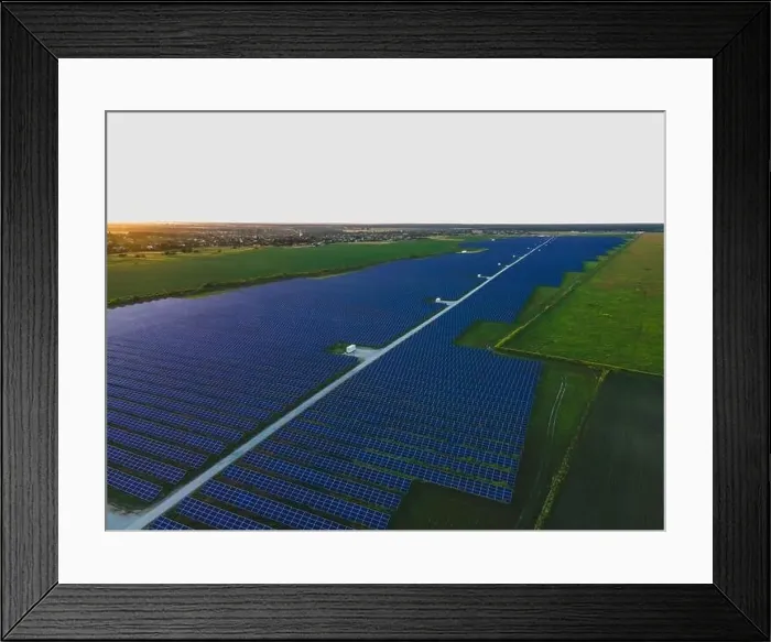 Framed Print : Aerial drone view of large solar panels at a solar farm at bright summer sunset. Solar cell power plants, colorful photo
