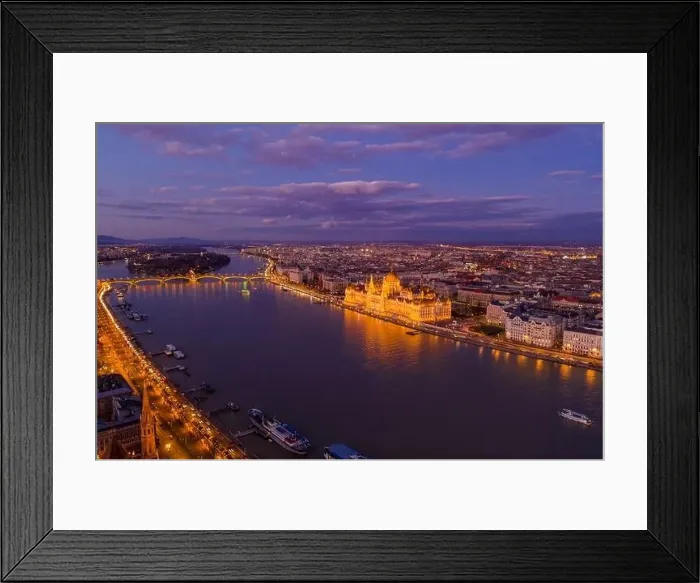 Framed Print : Aerial drone of lighted Hungarian Parliament by Danube river in Budapest sunset hour Framed Print : Aerial drone of lighted Hungarian Parliament by Danube river in Budapest sunset hour