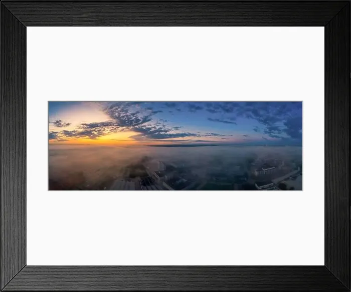 Framed Print : Foggy morning sunrise view over a business district with office buildings covered by the upcoming fog of the early