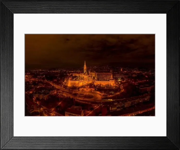 Framed Print : Aerial drone shot of Matthias Church with lights on Buda Hill in Budapest evening Framed Print : Aerial drone shot of Matthias Church with lights on Buda Hill in Budapest evening