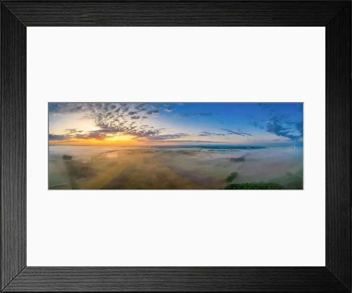Framed Print : Sunrise glow over a foggy field in bavaria, germany at a wonderful morning in summer Framed Print : Sunrise glow over a foggy field in bavaria, germany at a wonderful morning in summer