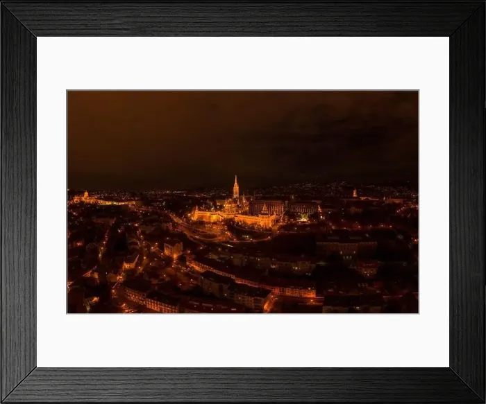 Framed Print : Aerial drone shot of Matthias Church with lights on Buda Hill in Budapest evening Framed Print : Aerial drone shot of Matthias Church with lights on Buda Hill in Budapest evening