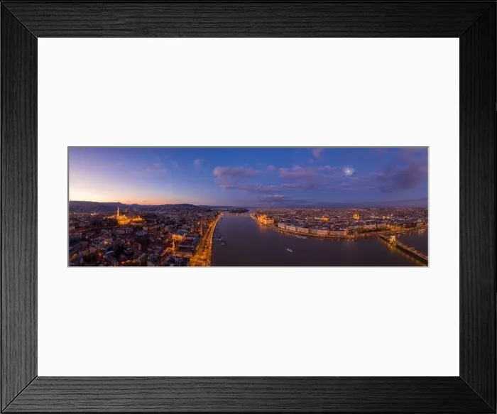 Framed Print : Panoramic aerial drone shot of Danube river with lighted quai with purple sky during Budapest sunset Framed Print : Panoramic aerial drone shot of Danube river with lighted quai with purple sky during Budapest sunset