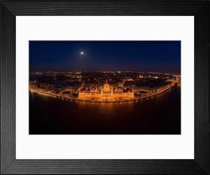 Framed Print : High angle panorama aerial drone shot of front facade of Hungarian Parliament with lights Framed Print : High angle panorama aerial drone shot of front facade of Hungarian Parliament with lights