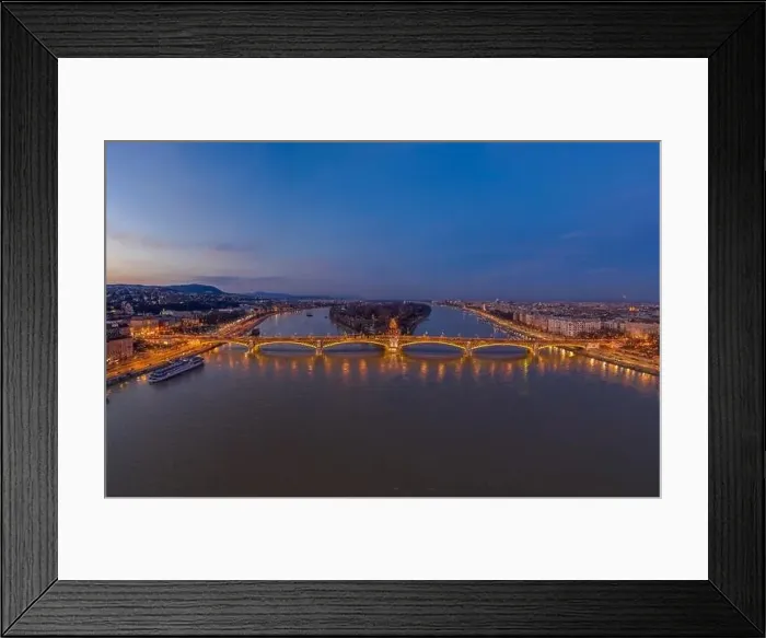 Framed Print : Aerial drone shot of Margaret Bridge with lights on over Danube river during Budapest sunset Framed Print : Aerial drone shot of Margaret Bridge with lights on over Danube river during Budapest sunset