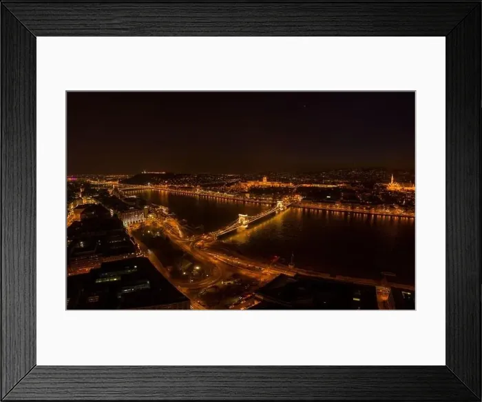 Framed Print : Aerial drone shot of Chain bridge over Danube and National Gallery with lights in Budapest night Framed Print : Aerial drone shot of Chain bridge over Danube and National Gallery with lights in Budapest night