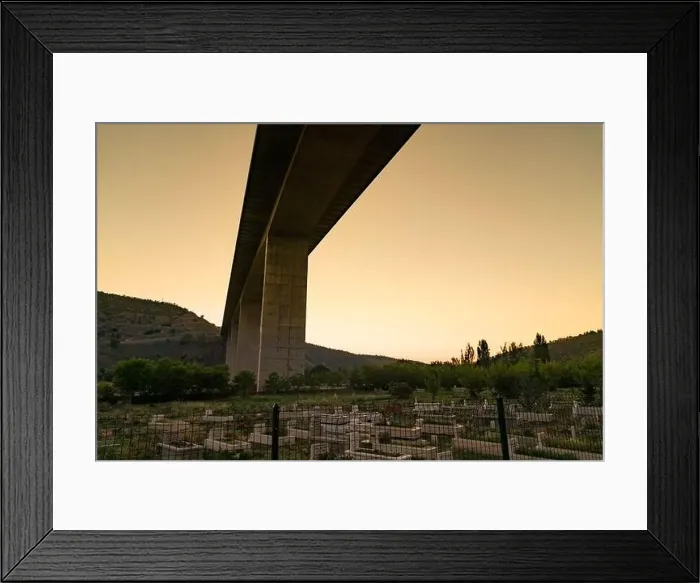 Framed Print : Ankara / Turkey-July 04 2020: Muslim cemetery under the highway viaduct
