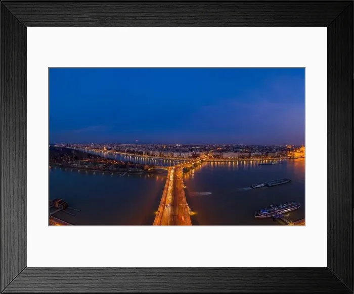 Framed Print : Aerial drone shot of Margaret Bridge with lights on over Danube river during Budapest sunset Framed Print : Aerial drone shot of Margaret Bridge with lights on over Danube river during Budapest sunset
