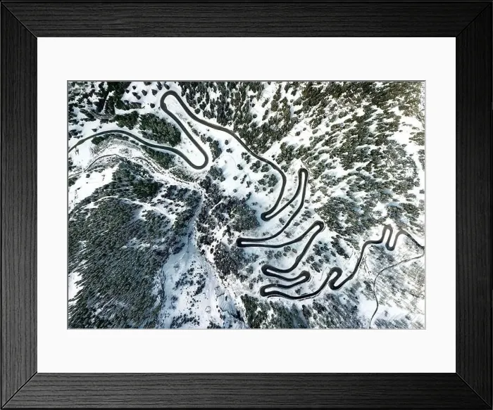 Framed Print : Aerial view by drone on the most spectacular pass road in Swiss Alps - Maloja Pass in Grison, Switzerland Framed Print : Aerial view by drone on the most spectacular pass road in Swiss Alps - Maloja Pass in Grison, Switzerland
