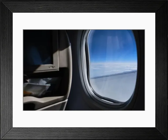 Framed Print : Porthole sky view. Commercial airplane window view from passenger seat Framed Print : Porthole sky view. Commercial airplane window view from passenger seat