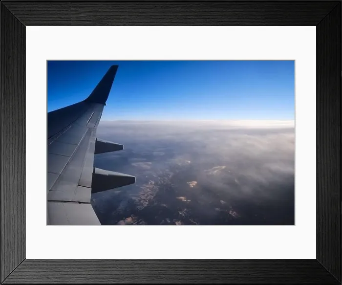 Framed Print : Sunset view from airplane window. Fog mountain at sunset aerial view Framed Print : Sunset view from airplane window. Fog mountain at sunset aerial view