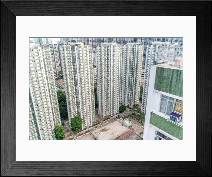 Framed Print : The view of residential neighborhood and skyscrapers from rooftop in Hong Kong Framed Print : The view of residential neighborhood and skyscrapers from rooftop in Hong Kong