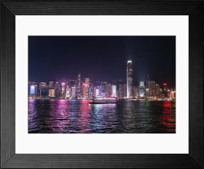 Framed Print : The incredible night cityscape view of lights on the water on Victoria Harbour in Hong Kong Framed Print : The incredible night cityscape view of lights on the water on Victoria Harbour in Hong Kong