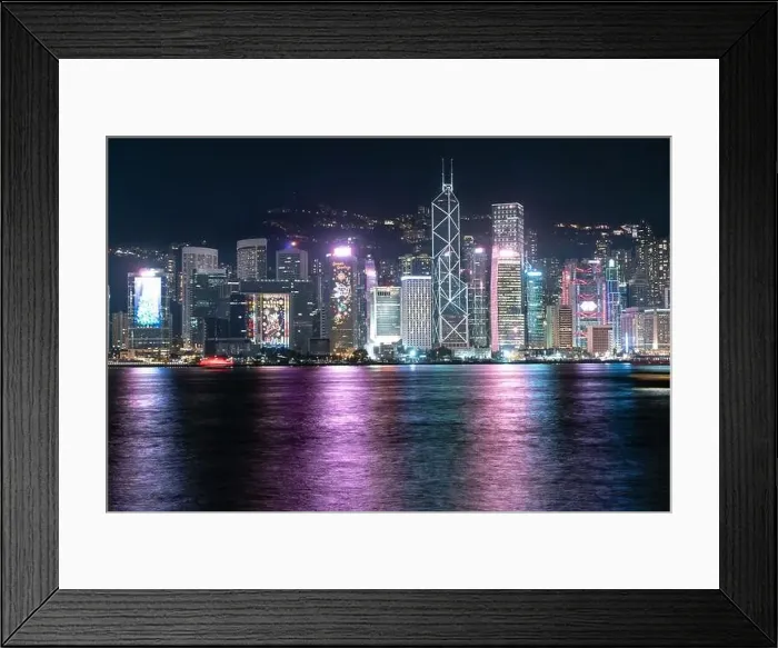 Framed Print : The incredible night cityscape view of lights on the water on Victoria Harbour in Hong Kong Framed Print : The incredible night cityscape view of lights on the water on Victoria Harbour in Hong Kong