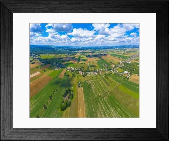 Framed Print : Stunning aerial panorama from a drone of countryside, village, green fields and trees, agriculture concept Framed Print : Stunning aerial panorama from a drone of countryside, village, green fields and trees, agriculture concept