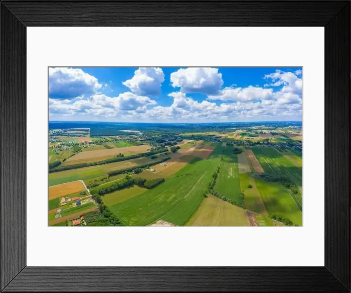 Framed Print : Stunning aerial panorama from a drone of countryside, village, green fields and trees, agriculture concept Framed Print : Stunning aerial panorama from a drone of countryside, village, green fields and trees, agriculture concept
