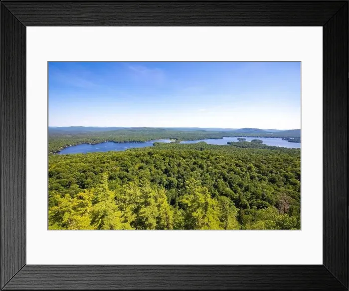 Framed Print : Scenic aerial view of a blue lake with pine trees coast line Framed Print : Scenic aerial view of a blue lake with pine trees coast line