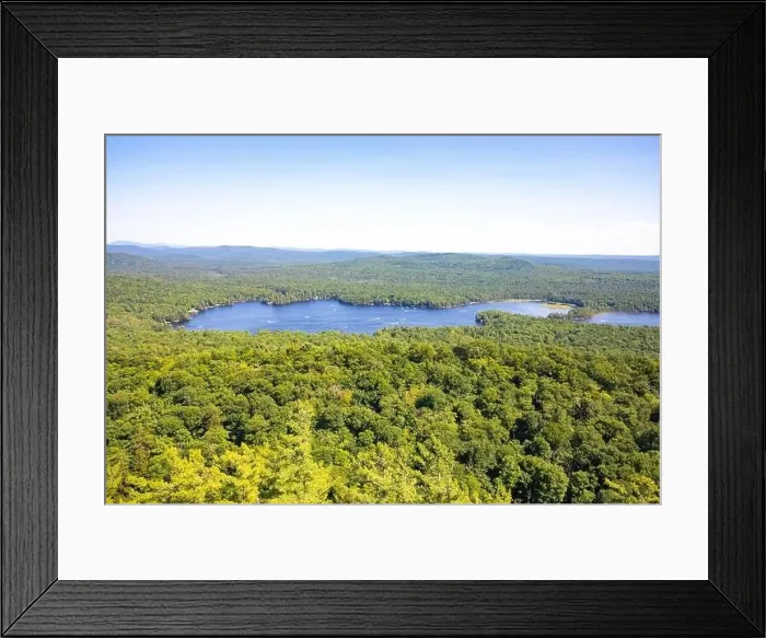 Framed Print : Scenic aerial view of a blue lake with pine trees coast line Framed Print : Scenic aerial view of a blue lake with pine trees coast line